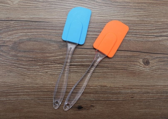 Utensili della cucina del silicone del laureato dell'alimento, spatola della ruspa spianatrice del silicone con la maniglia ovale trasparente